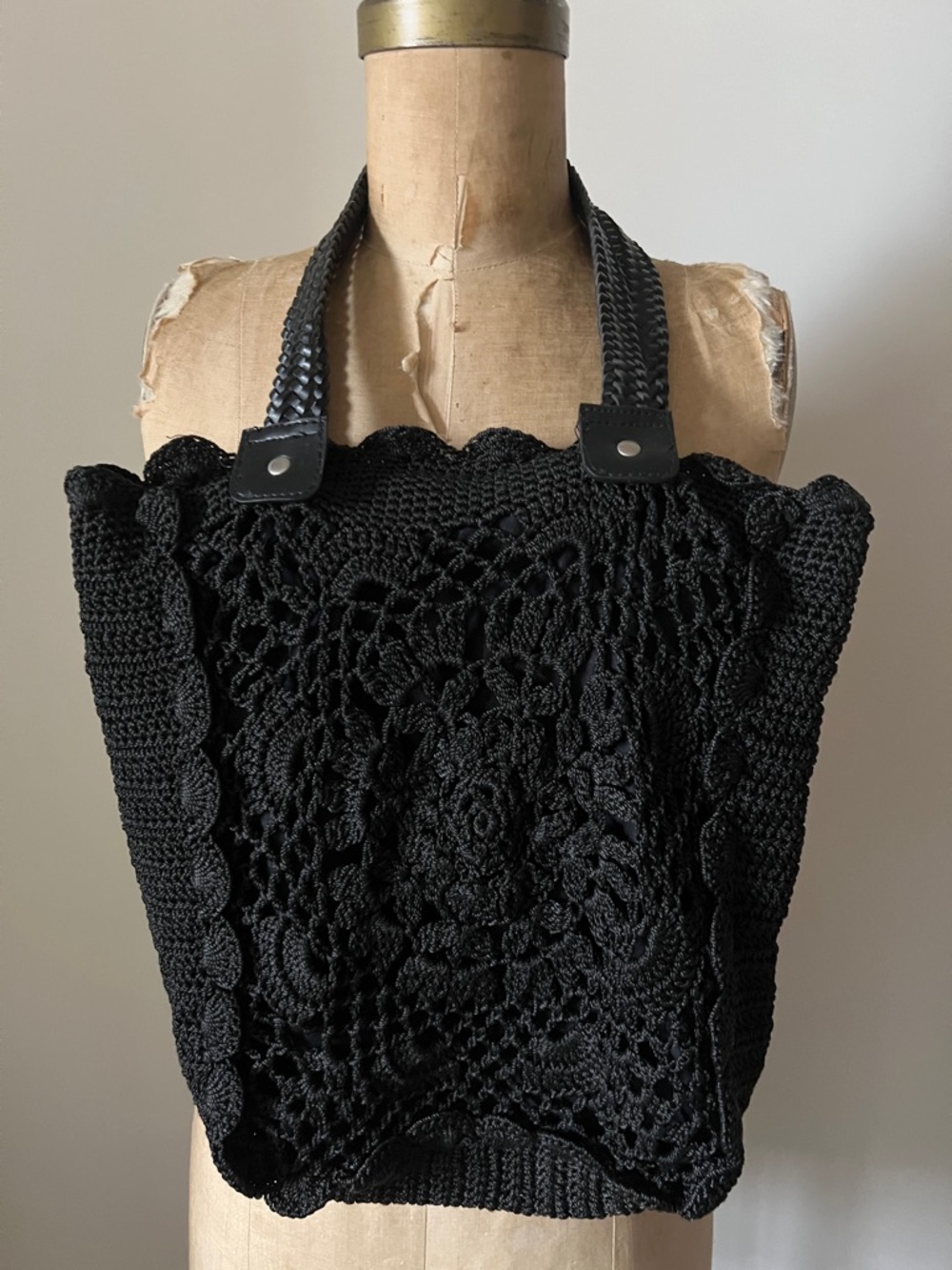 Black woven handbag